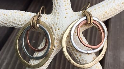 Antique-style gold and silver earrings with vintage charm