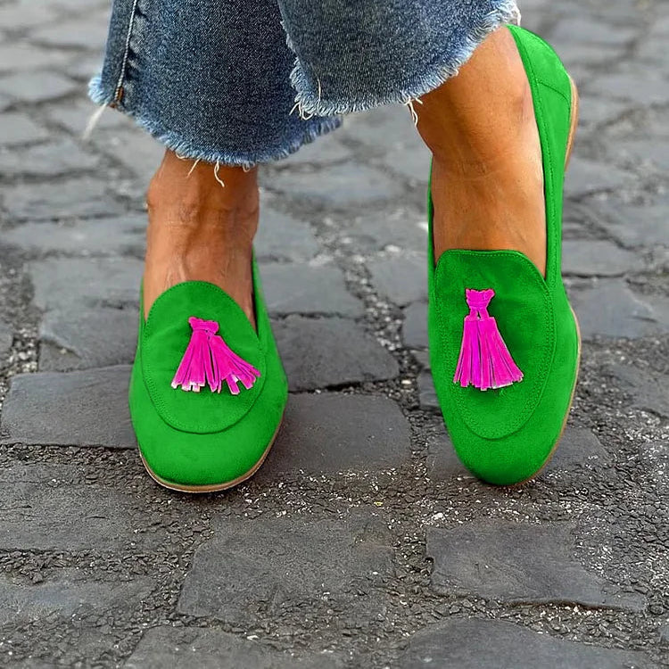 Green Loafer with a vibrant fuchsia tassel