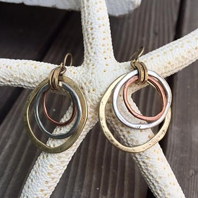 Antique-style gold and silver earrings with vintage charm