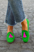 Green Loafer with a vibrant fuchsia tassel